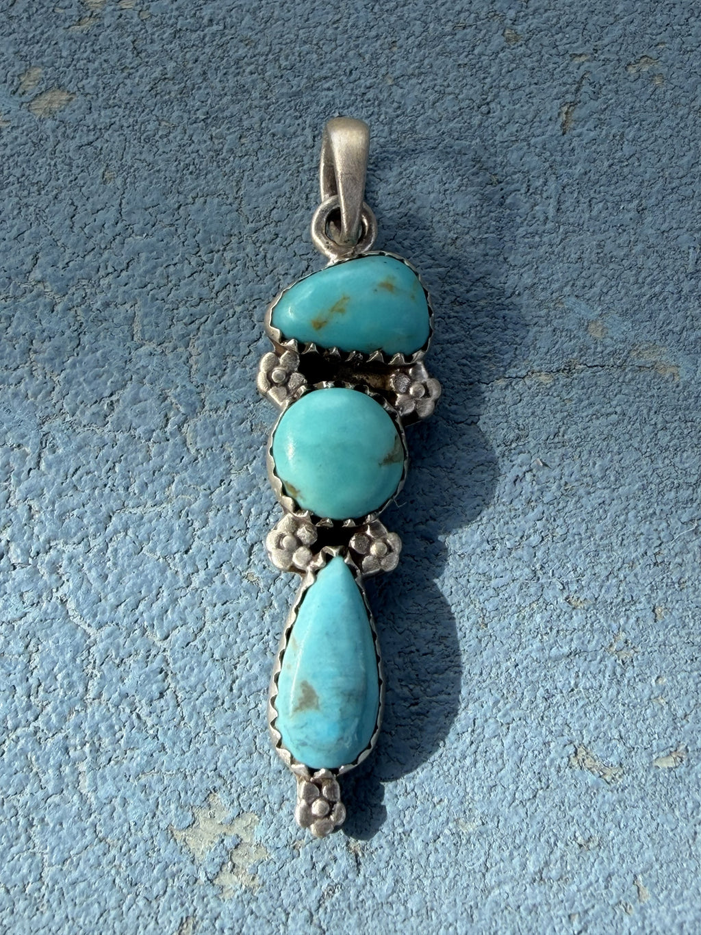 Small Sterling Silver Pendant with Turquoise Stones and Flower Embellishments