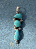 Small Sterling Silver Pendant with Turquoise Stones and Flower Embellishments