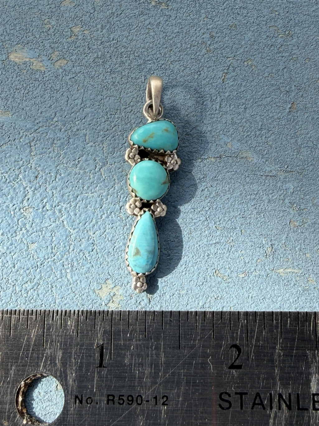Small Sterling Silver Pendant with Turquoise Stones and Flower Embellishments