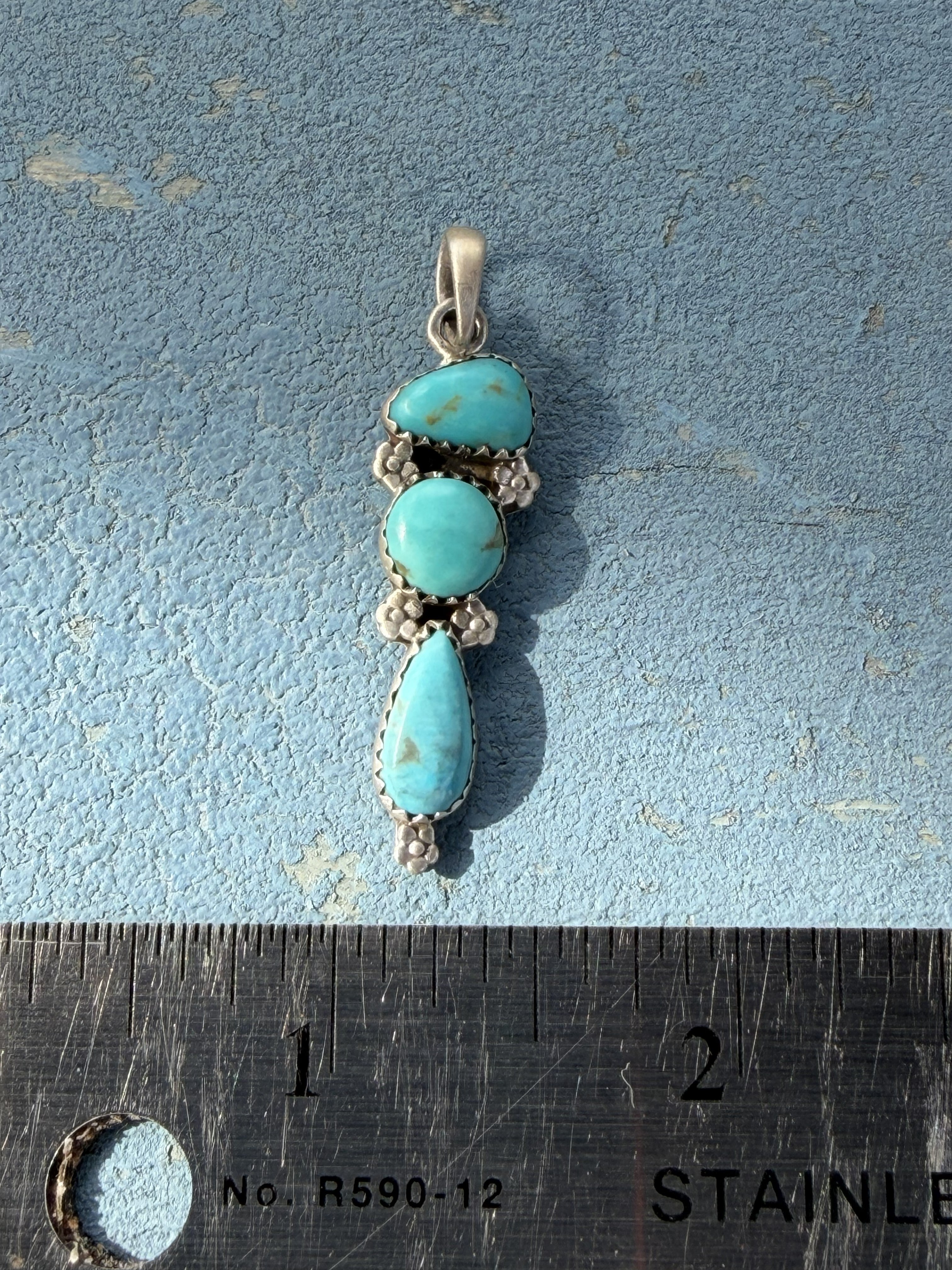 Small Sterling Silver Pendant with Turquoise Stones and Flower Embellishments